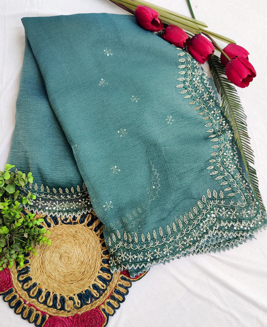 DARK GREY CRUSHED CHIFFON SAREE WITH HAND EMBROIDERED BORDER.