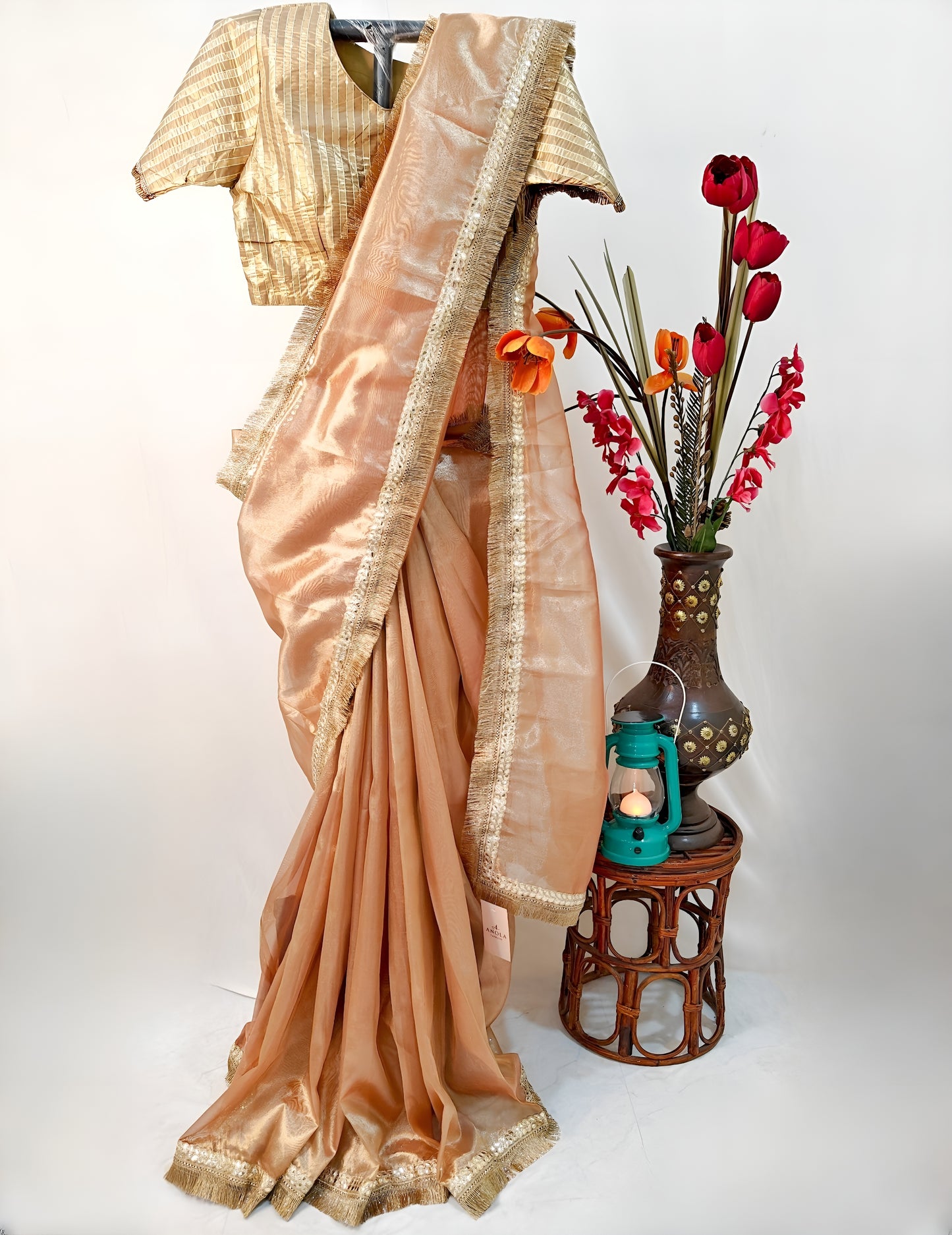 PURE TISSUE GOLD SAREE WITH FRINGE DETAILING.