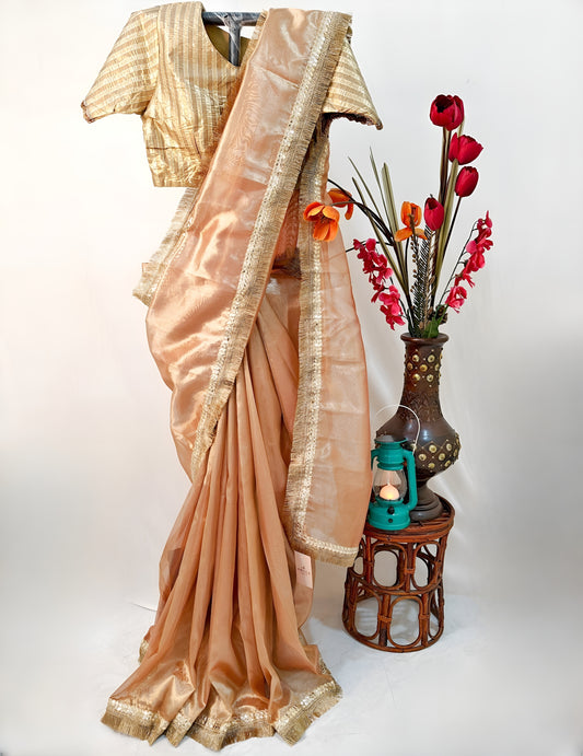 PURE TISSUE GOLD SAREE WITH FRINGE DETAILING.