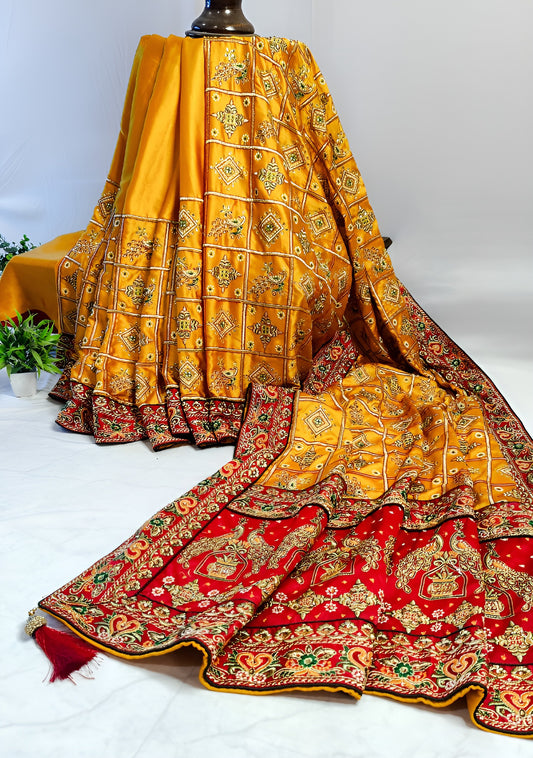 YELLOW SATIN SILK SAREE WITH HEAVY RED BORDER.