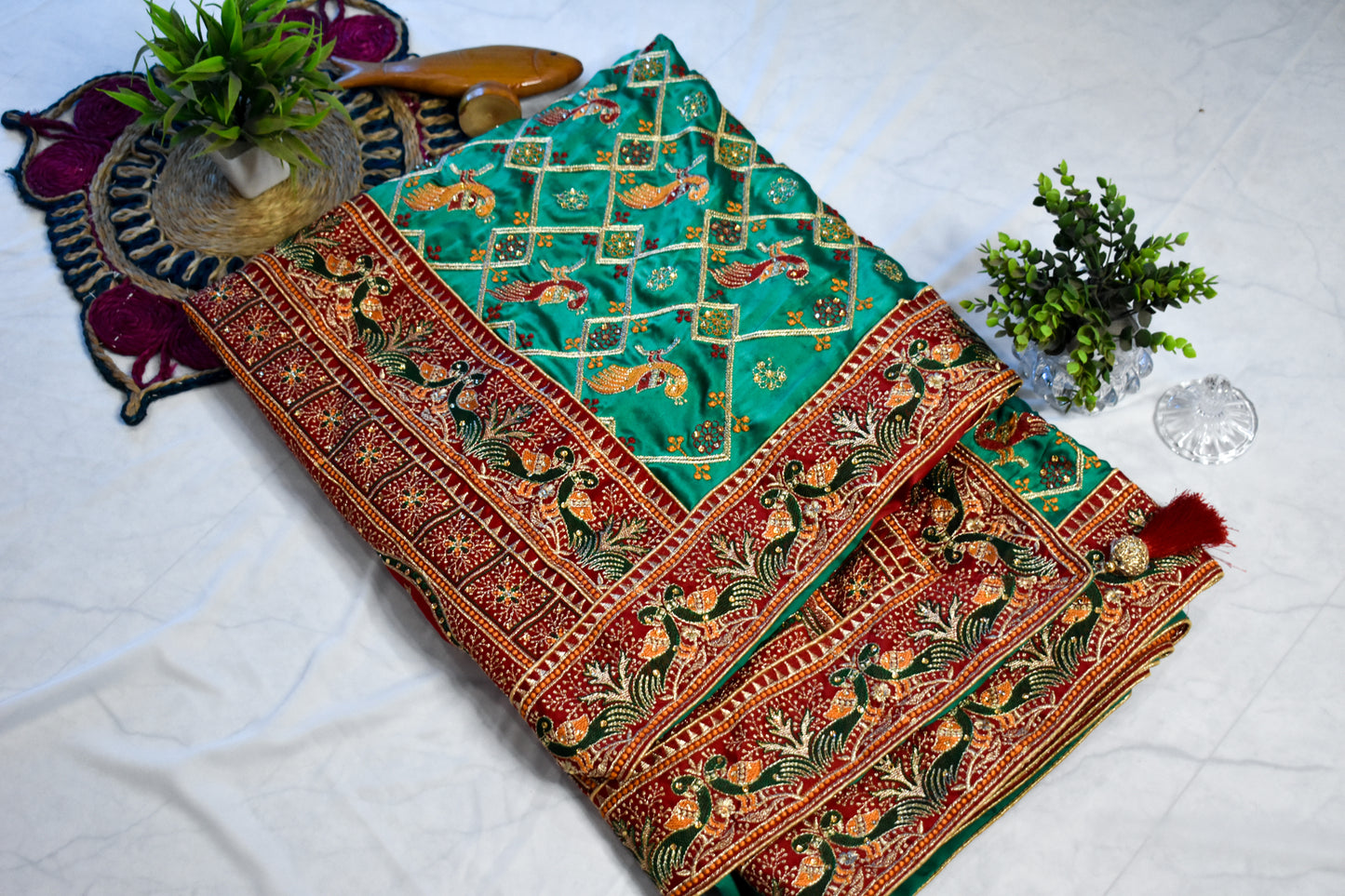 GREEN SATIN SILK SAREE WITH RED BORDER.