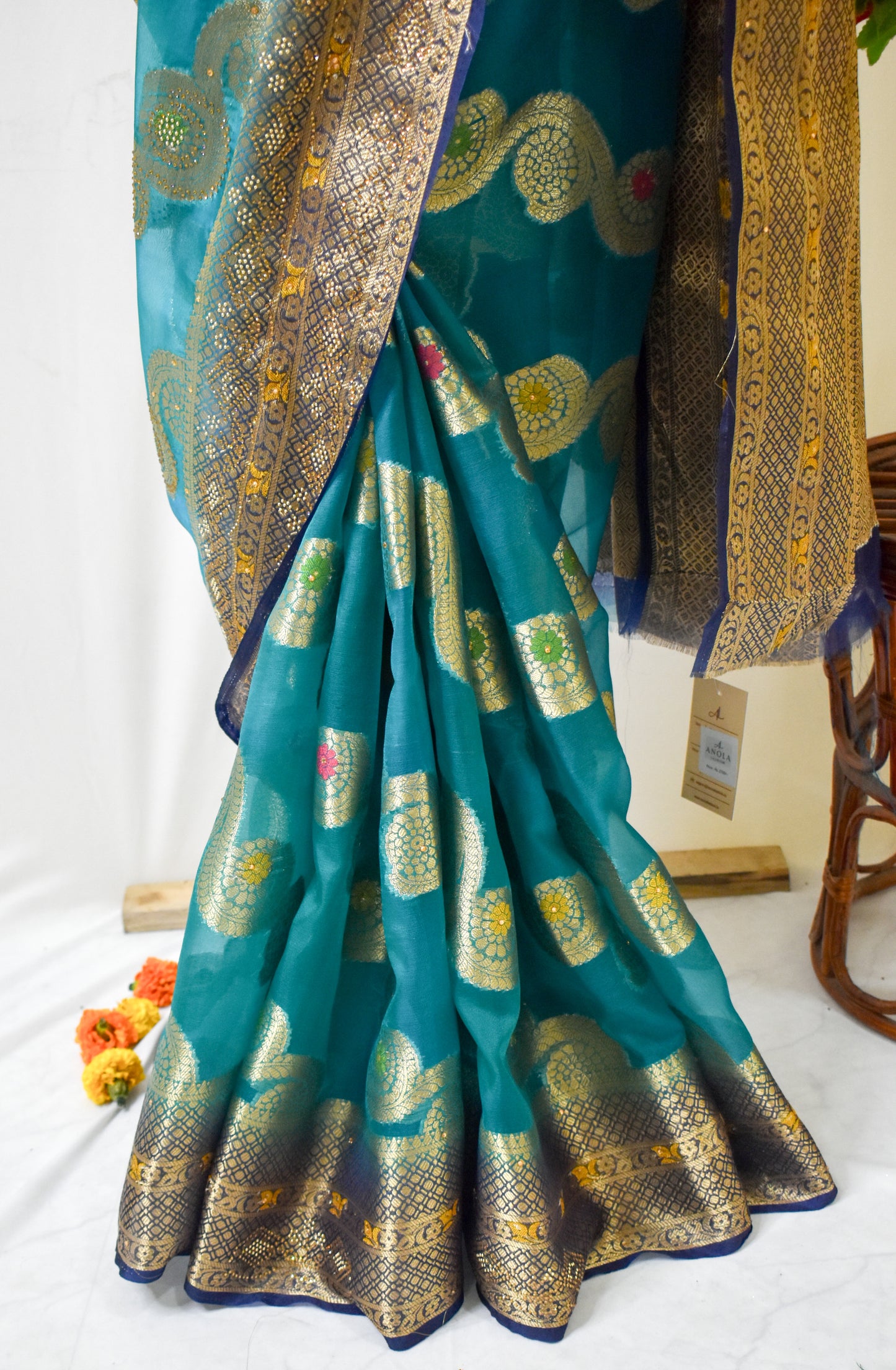 TEAL BLUE ORGANZA SILK SAREE WITH INTRICATE DARK BLUE AND GOLDEN ZARI WEAVING.