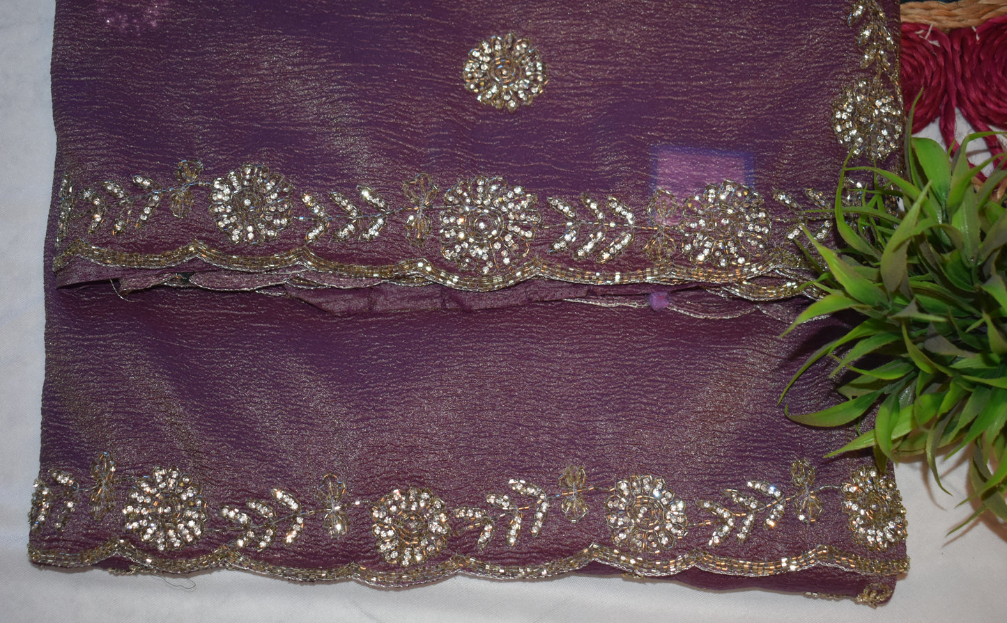 ROYAL MAUVE CRUSHED CHIFFON SAREE WITH HAND-EMBROIDERY BORDER.