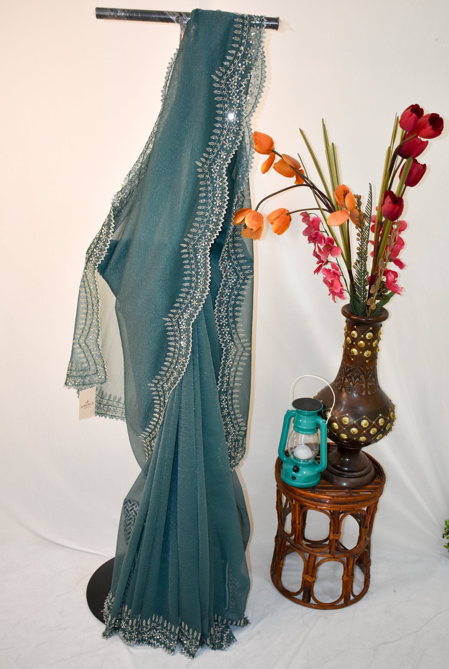 DARK GREY CRUSHED CHIFFON SAREE WITH HAND EMBROIDERED BORDER.