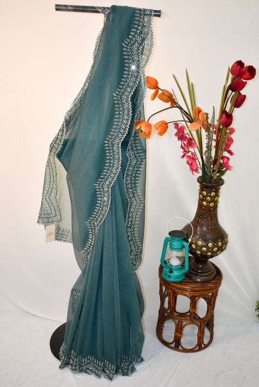 DARK GREY CRUSHED CHIFFON SAREE WITH HAND EMBROIDERED BORDER.