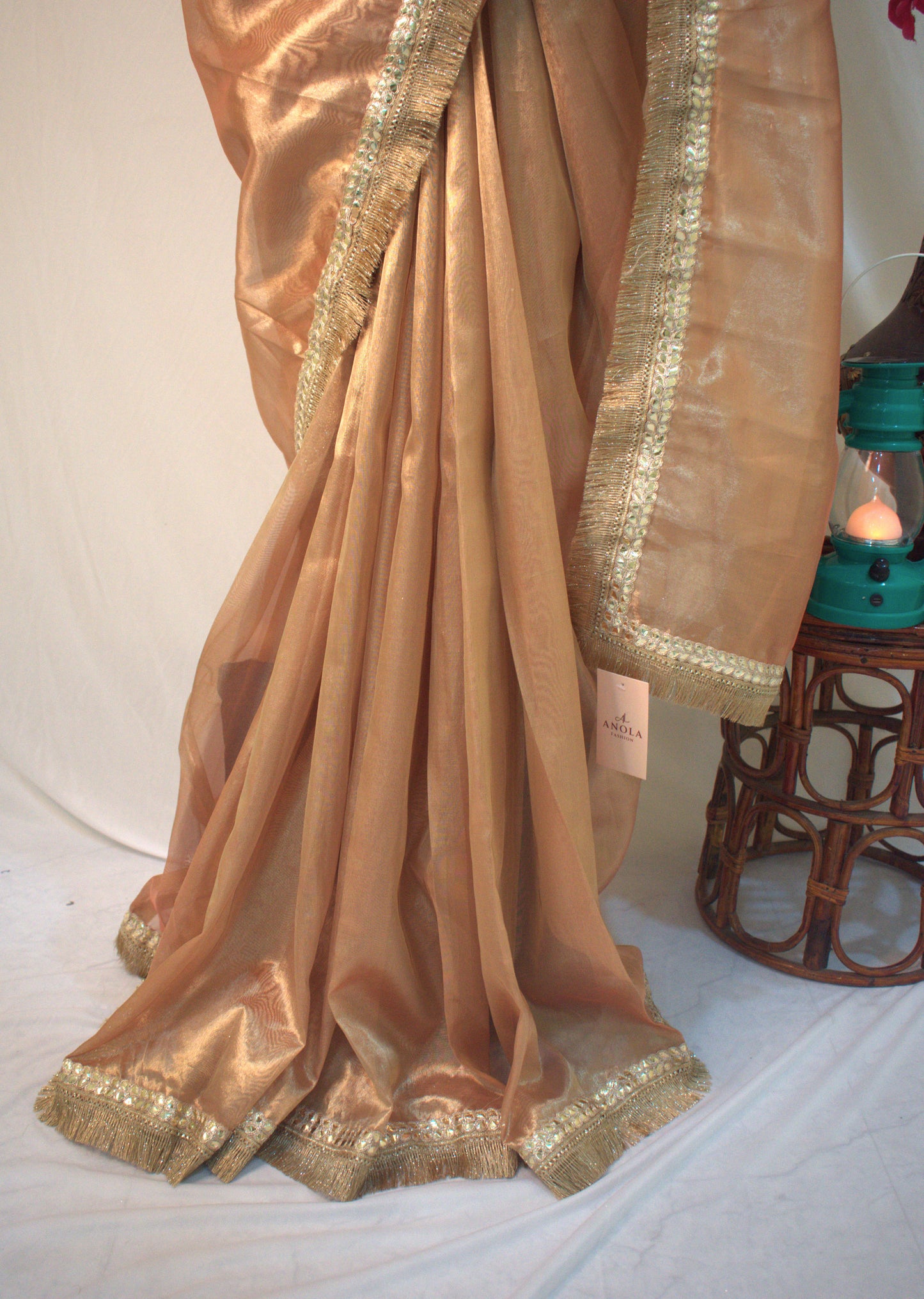 PURE TISSUE GOLD SAREE WITH FRINGE DETAILING.