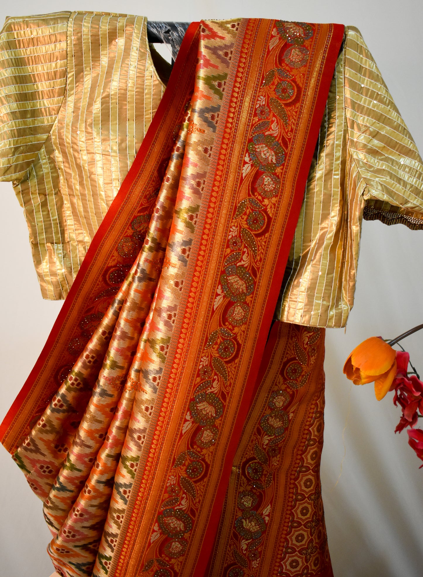RED ART SILK SAREE WITH GOLDEN ZARI & IKAT- INSPIRED MOTIFS.