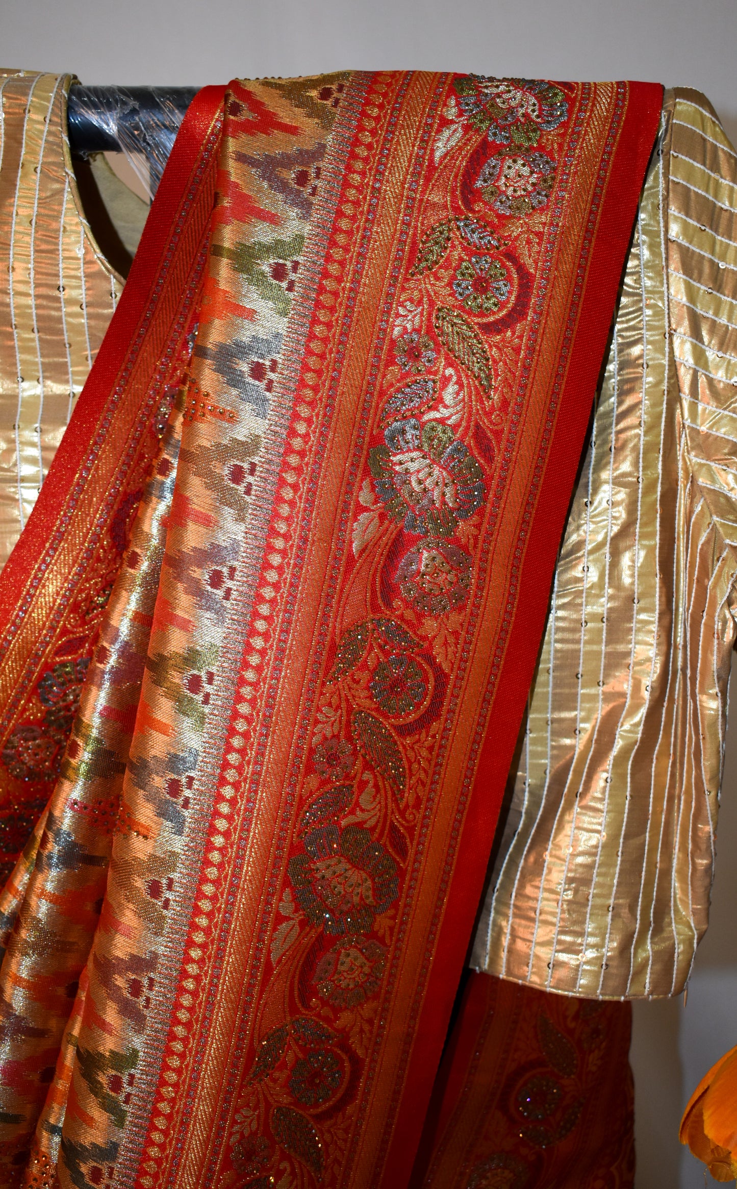 RED ART SILK SAREE WITH GOLDEN ZARI & IKAT- INSPIRED MOTIFS.