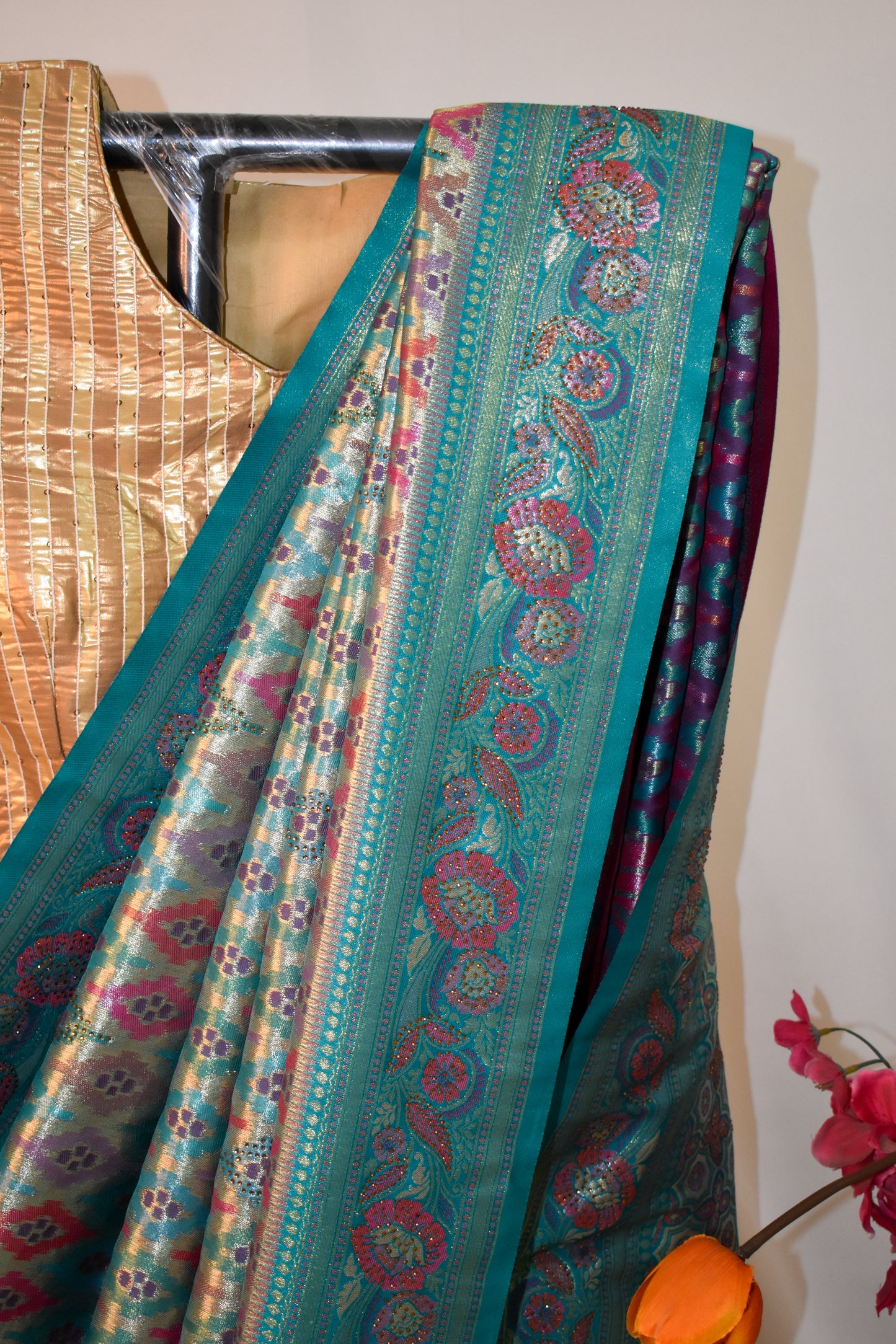 TEAL ELEGANCE – BANARASI ART SILK SAREE WITH GOLDEN ZARI & IKAT-INSPIRED MOTIFS.