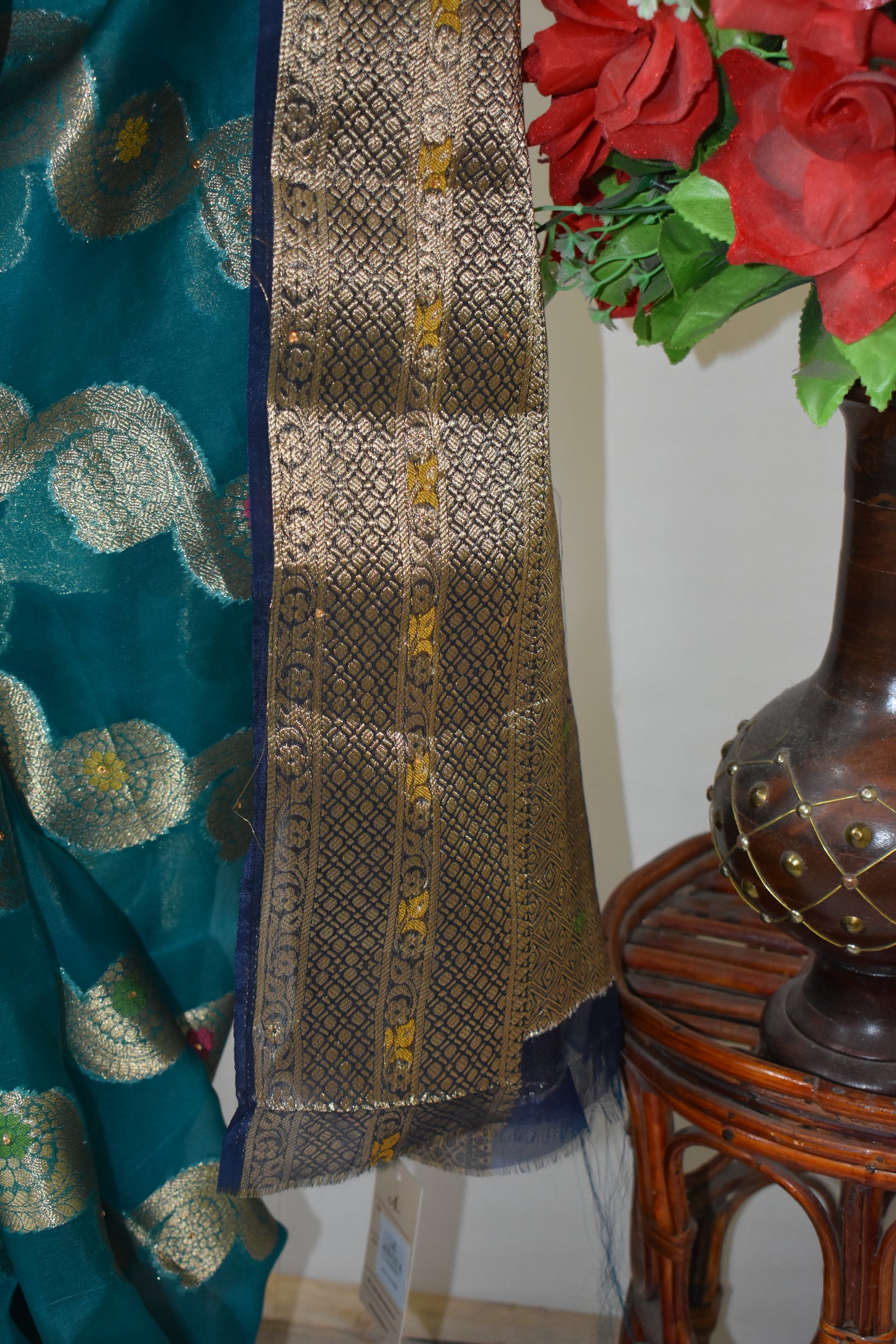 TEAL BLUE ORGANZA SILK SAREE WITH INTRICATE DARK BLUE AND GOLDEN ZARI WEAVING.