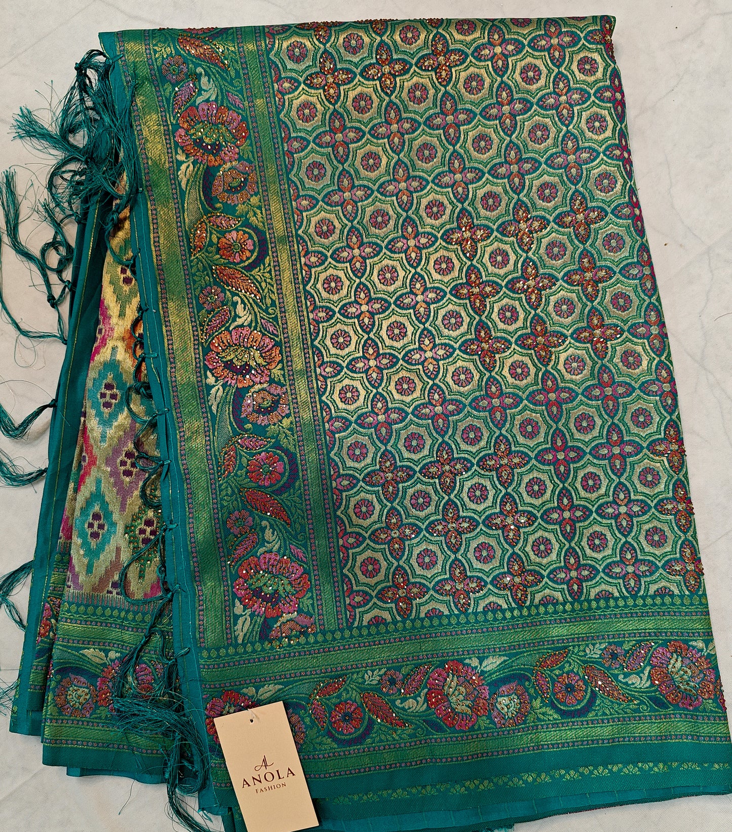 TEAL ELEGANCE – BANARASI ART SILK SAREE WITH GOLDEN ZARI & IKAT-INSPIRED MOTIFS.