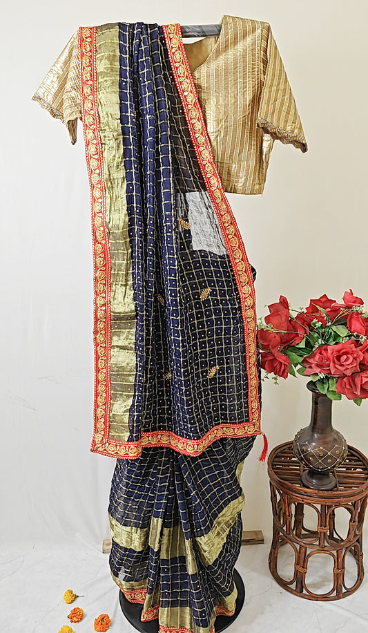 NAVY BLUE CRUSHED GEORGETTE BANDHANI SAREE WITH RED ZARI BORDER.
