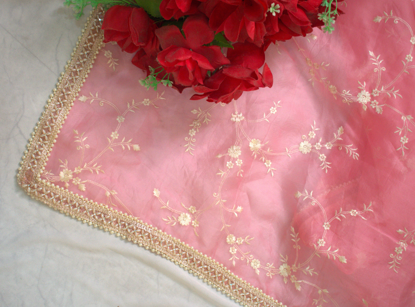 BABY PINK  PURE ORGANZA SAREE ADORNED WITH OFF-WHITE EMBROIDERY & PEARL EMBELLISHED BORDER.
