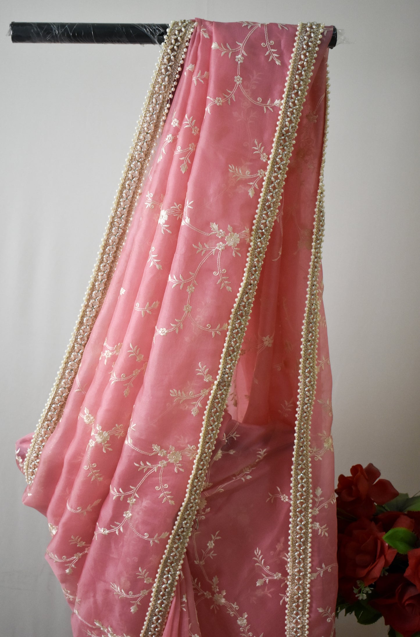 BABY PINK  PURE ORGANZA SAREE ADORNED WITH OFF-WHITE EMBROIDERY & PEARL EMBELLISHED BORDER.