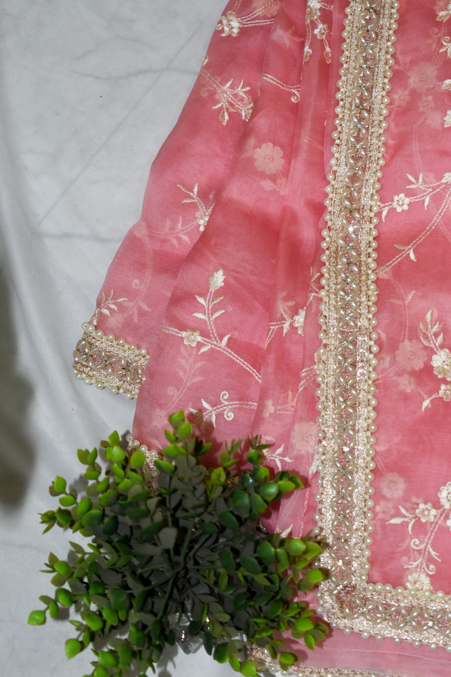 BABY PINK  PURE ORGANZA SAREE ADORNED WITH OFF-WHITE EMBROIDERY & PEARL EMBELLISHED BORDER.