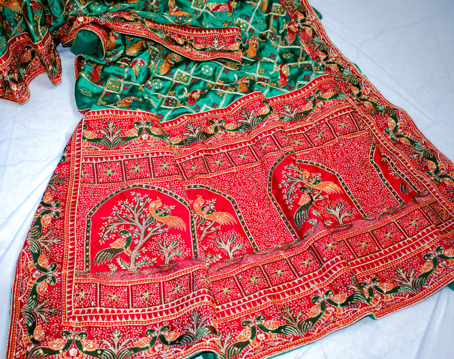 GREEN SATIN SILK SAREE WITH RED BORDER.