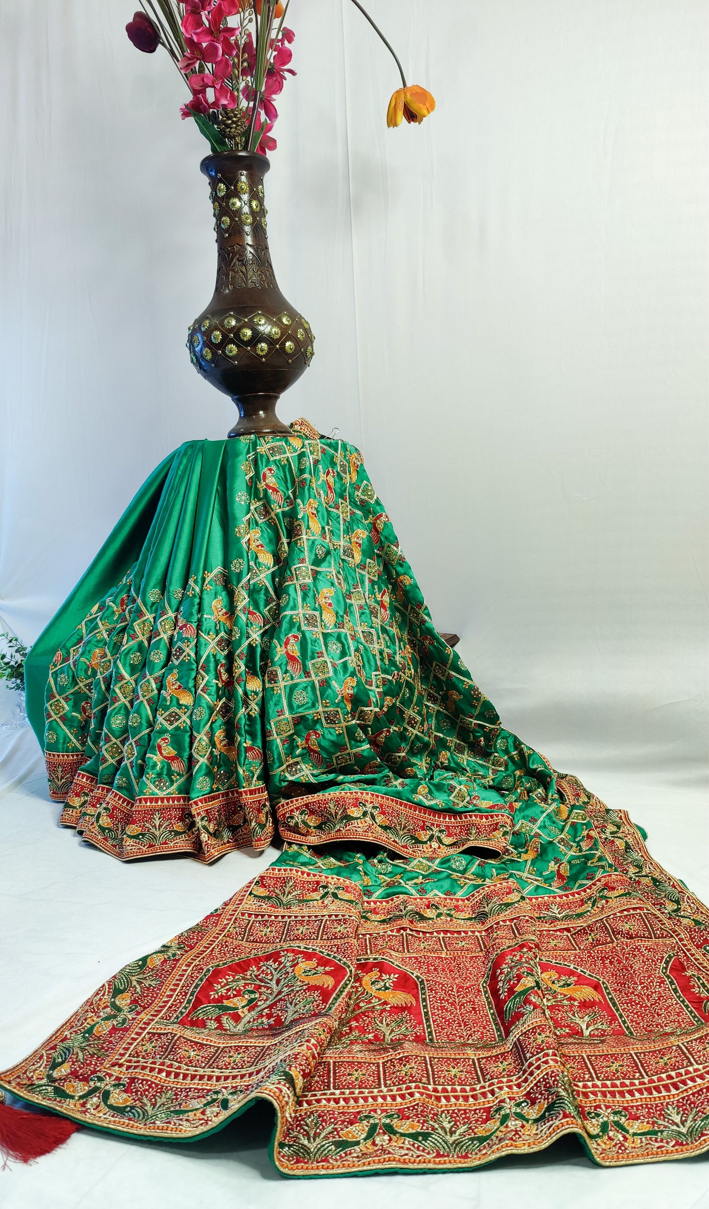 GREEN SATIN SILK SAREE WITH RED BORDER.