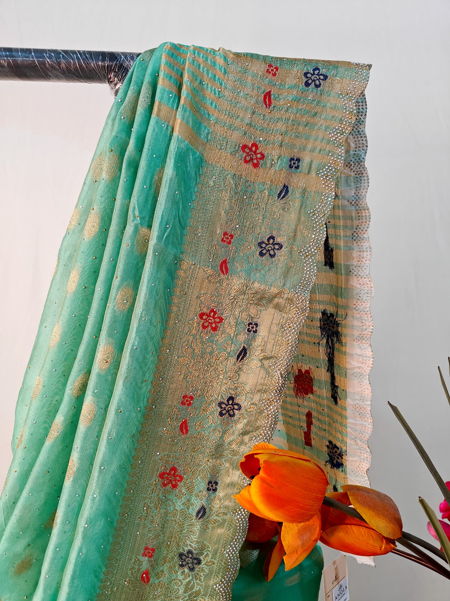 SEA GREEN SILK BLEND SAREE WITH ZARI, FLORAL BORDER & SWAROVSKI WORK.