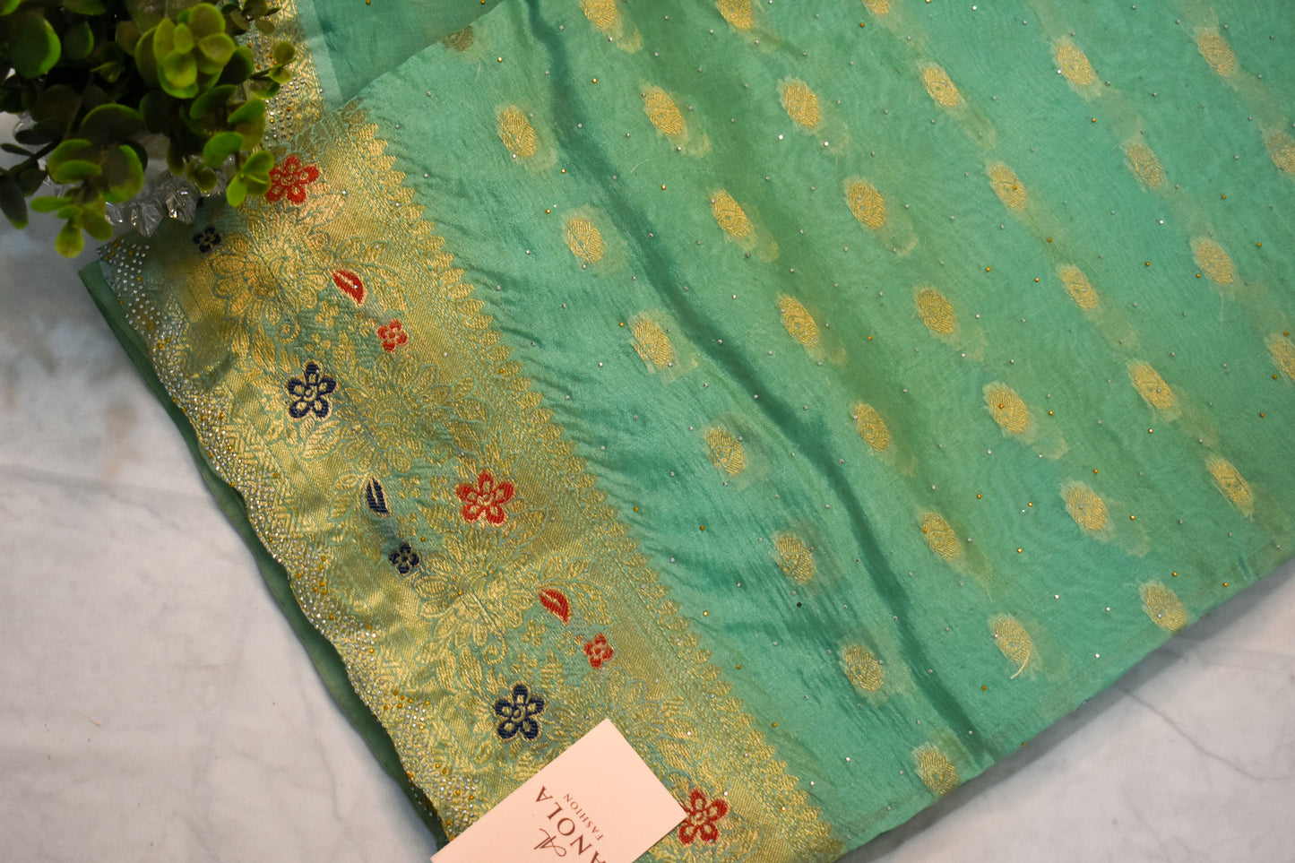 SEA GREEN SILK BLEND SAREE WITH ZARI, FLORAL BORDER & SWAROVSKI WORK.