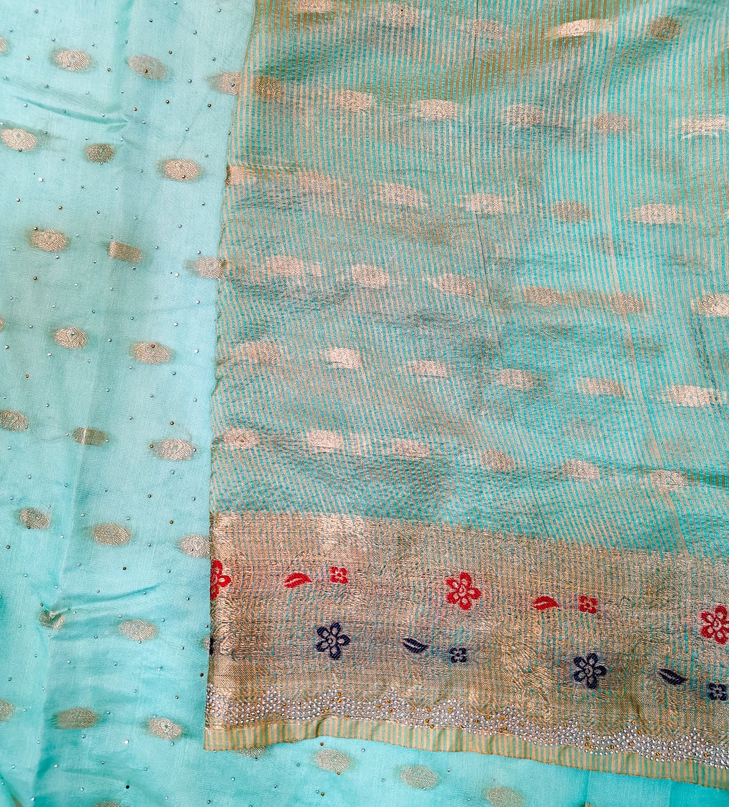 SEA GREEN SILK BLEND SAREE WITH ZARI, FLORAL BORDER & SWAROVSKI WORK.