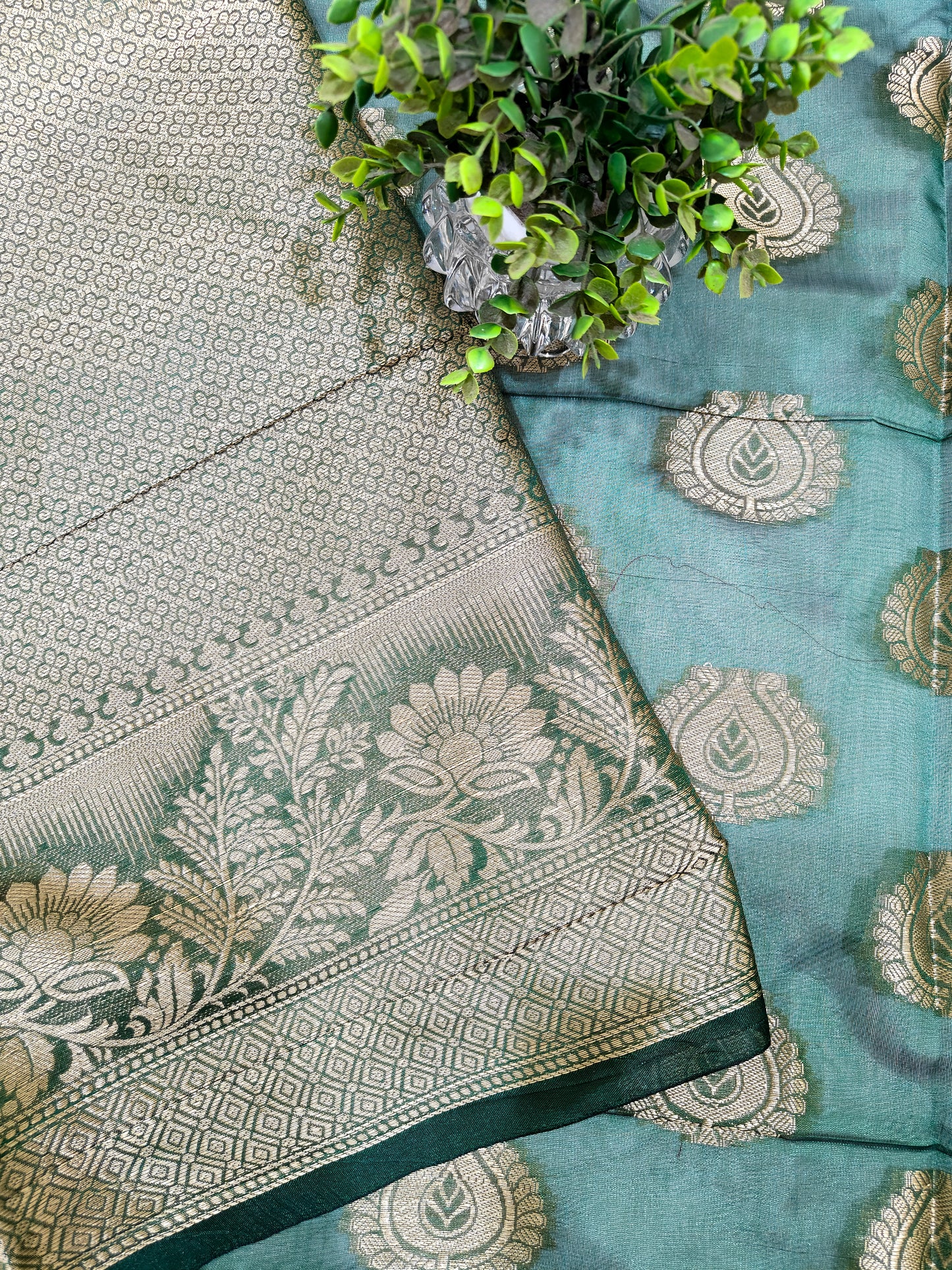 DARK BOTTLE GREEN SILK BLEND SAREE WITH INTRICATE GOLDEN ZARI WEAVING.