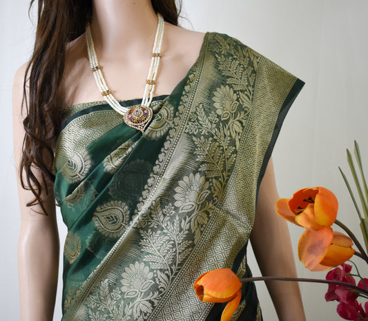 DARK BOTTLE GREEN SILK BLEND SAREE WITH INTRICATE GOLDEN ZARI WEAVING.
