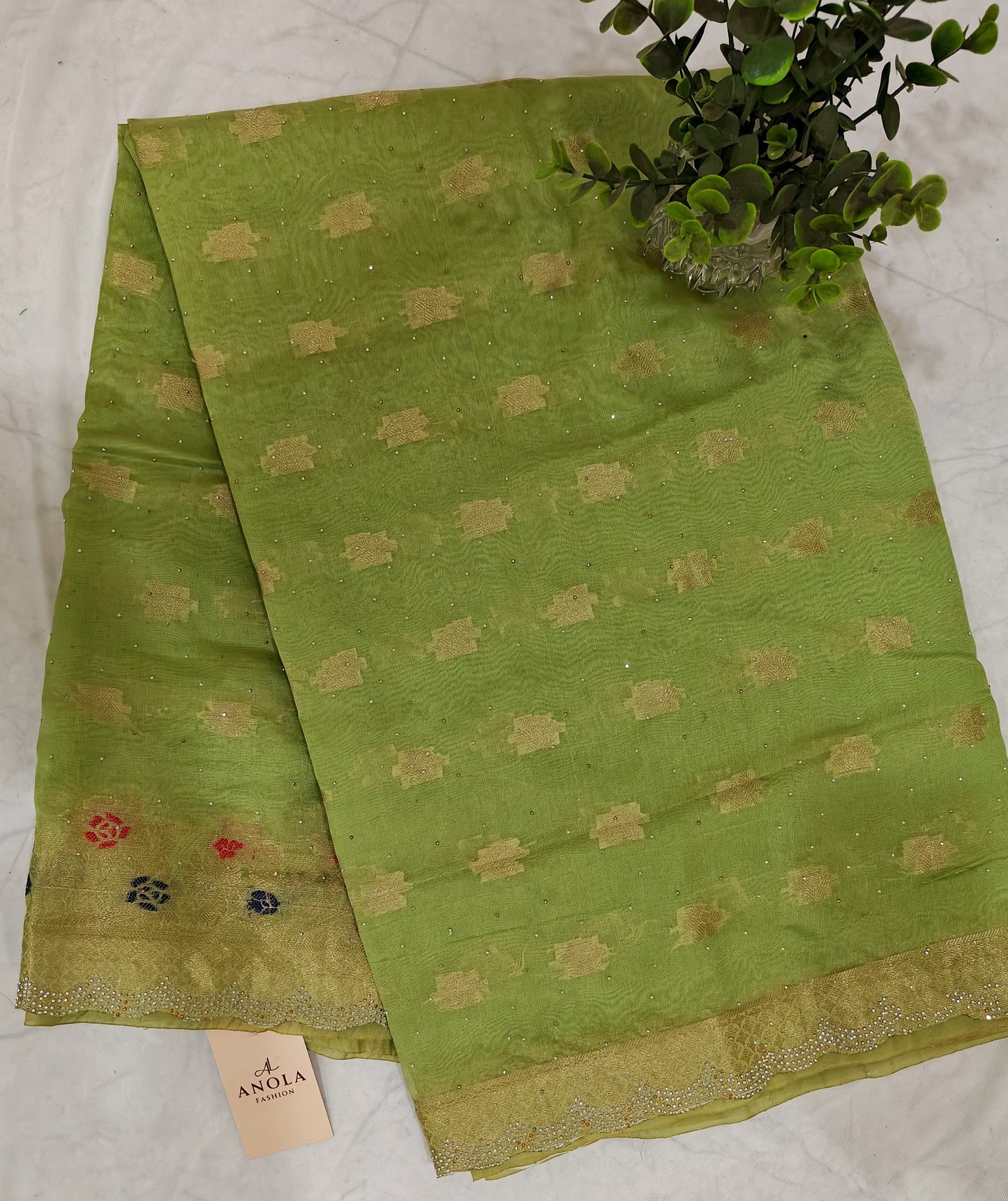 PARROT GREEN SILK BLEND SAREE WITH ZARI FLORAL BORDER & SWAROVSKI DETAILING.