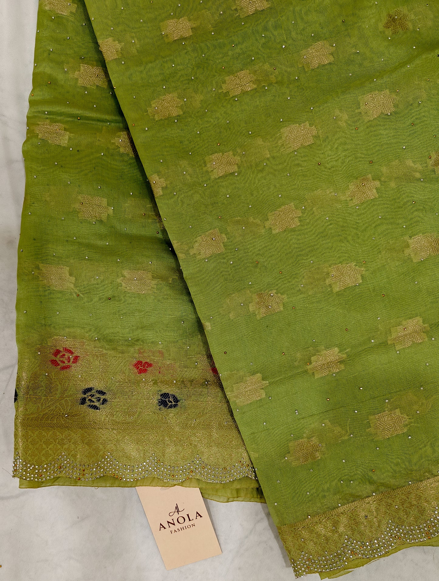 PARROT GREEN SILK BLEND SAREE WITH ZARI FLORAL BORDER & SWAROVSKI DETAILING.
