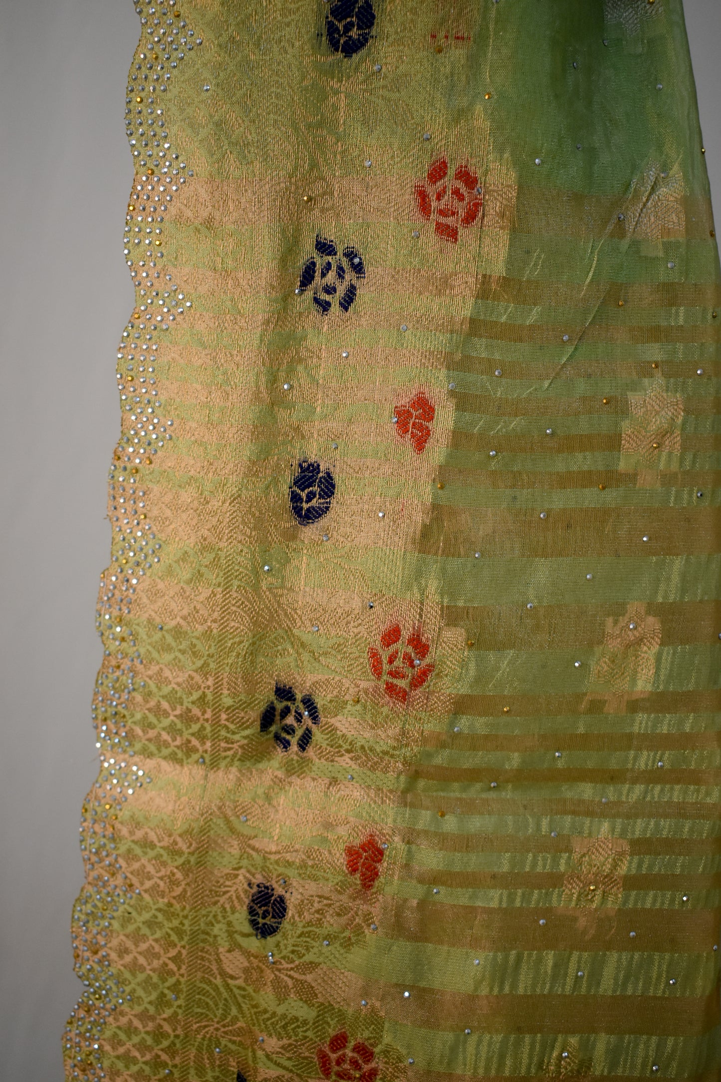 PARROT GREEN SILK BLEND SAREE WITH ZARI FLORAL BORDER & SWAROVSKI DETAILING.