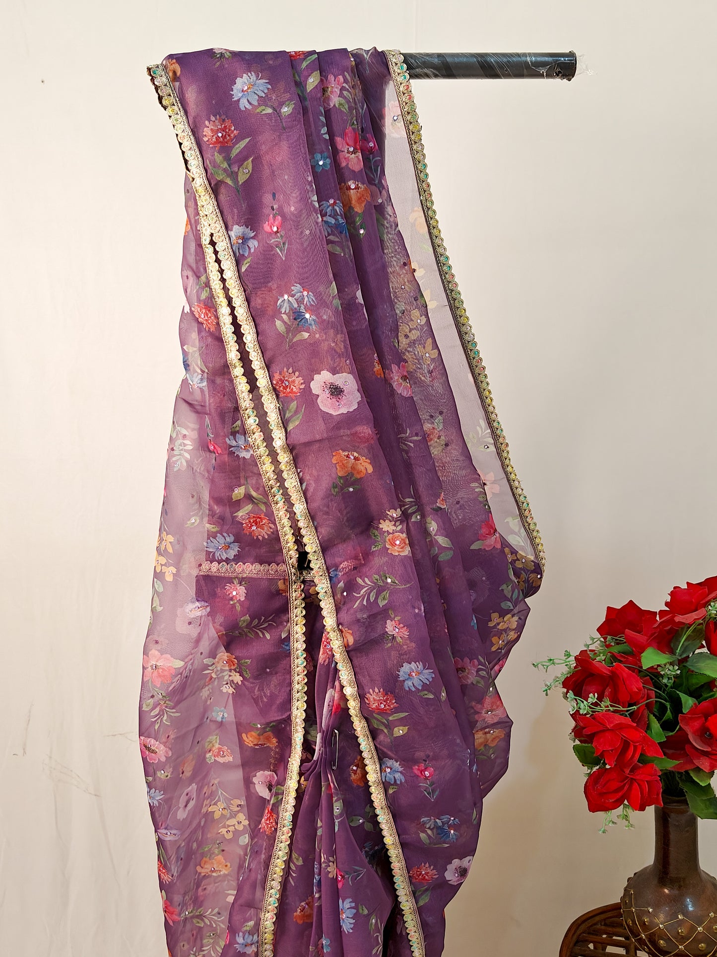 PURPLE ORGANZA FLORAL PRINT SAREE WITH MULTICOLOUR SEQUIN BORDER.