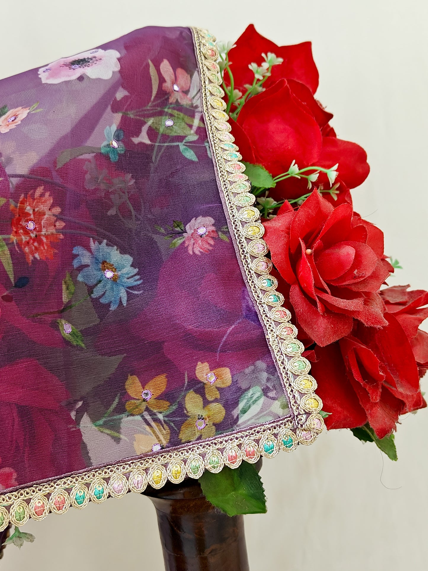 PURPLE ORGANZA FLORAL PRINT SAREE WITH MULTICOLOUR SEQUIN BORDER.