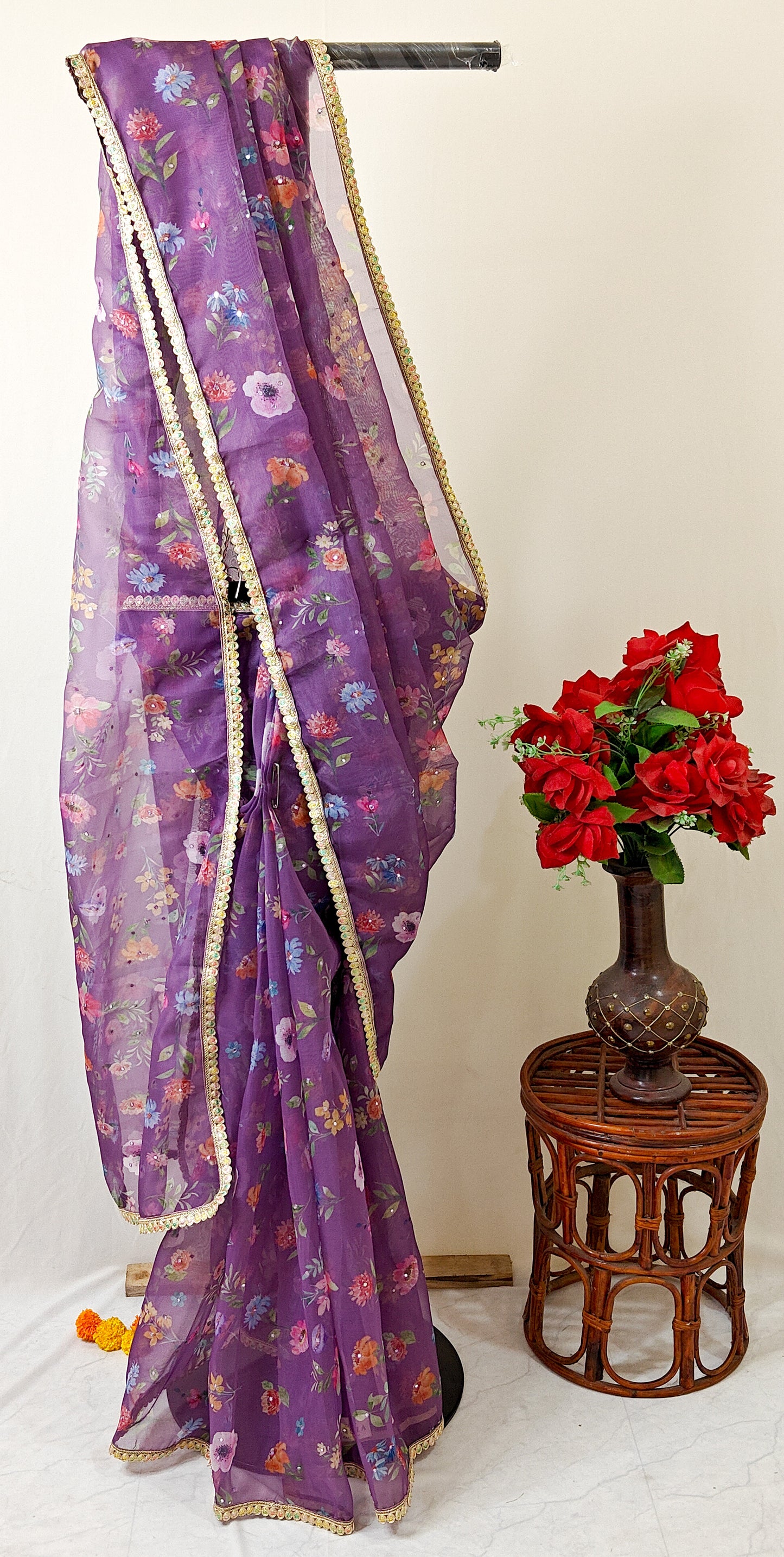 PURPLE ORGANZA FLORAL PRINT SAREE WITH MULTICOLOUR SEQUIN BORDER.