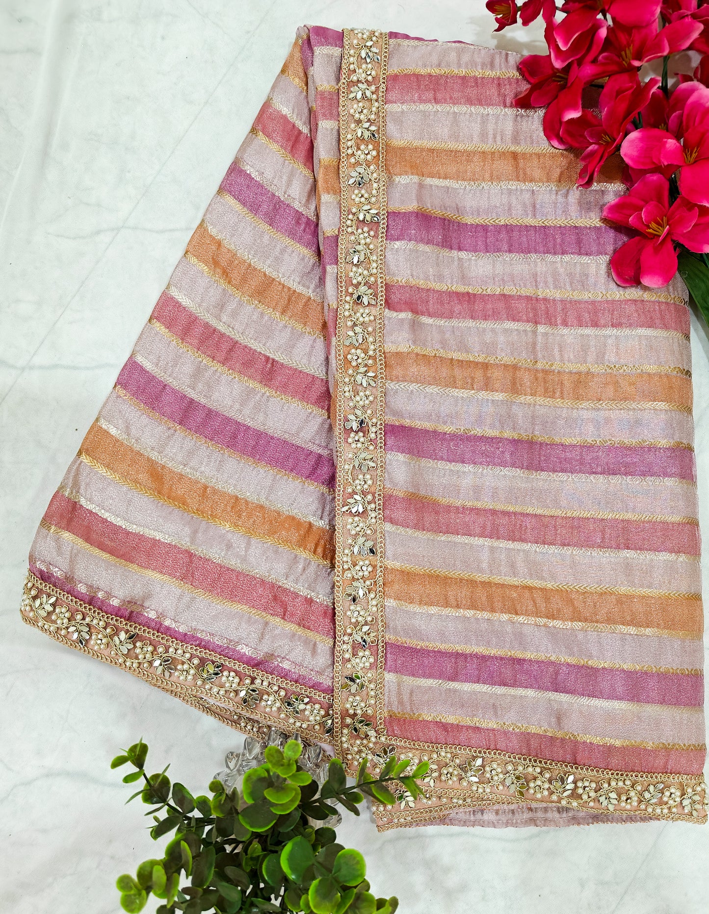 ORGANZA STRIPED SAREE IN PURPLE, LAVENDER, PINK, PEACH & GOLD WITH EMBELLISHED BORDER.