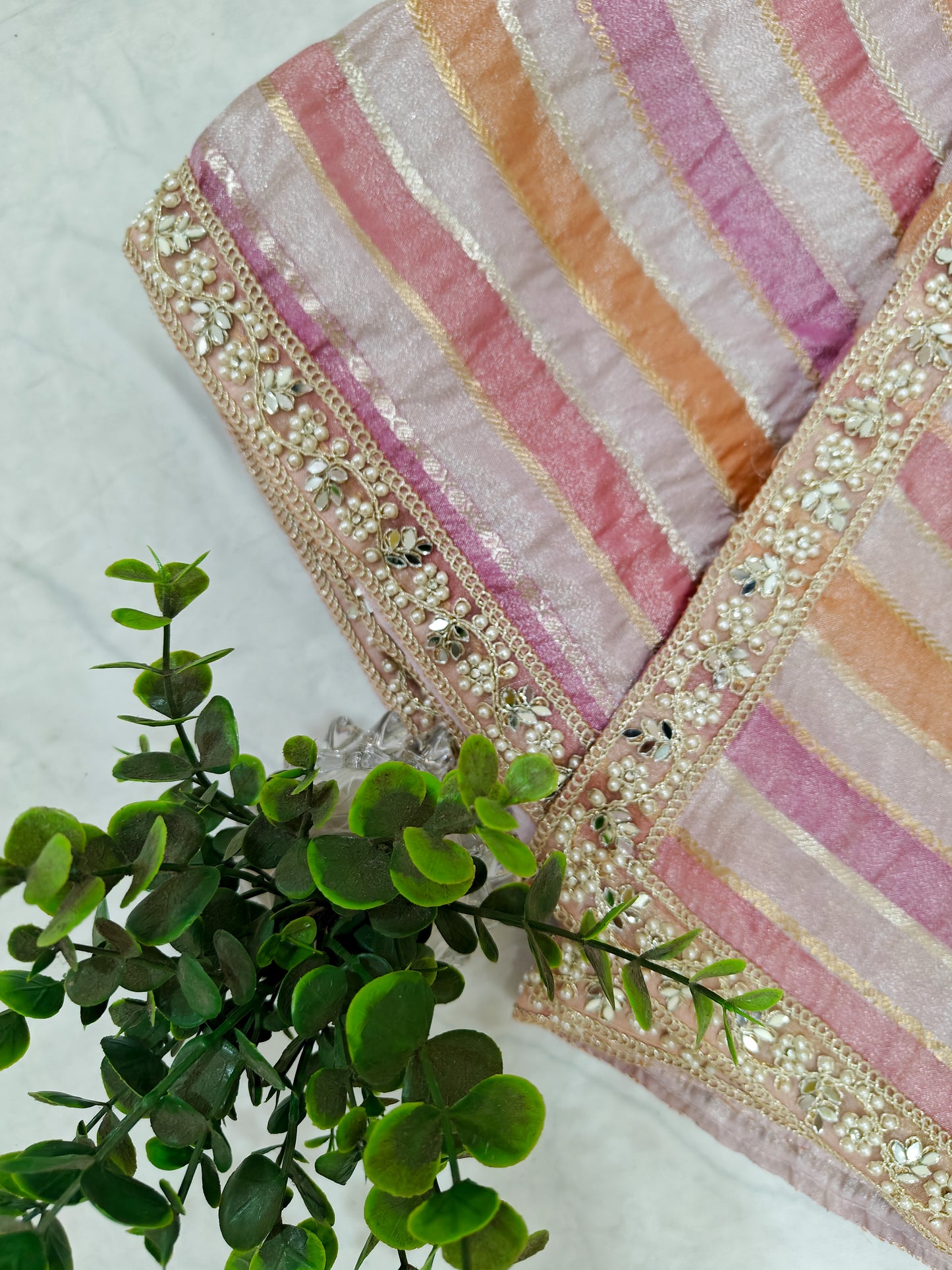 ORGANZA STRIPED SAREE IN PURPLE, LAVENDER, PINK, PEACH & GOLD WITH EMBELLISHED BORDER.