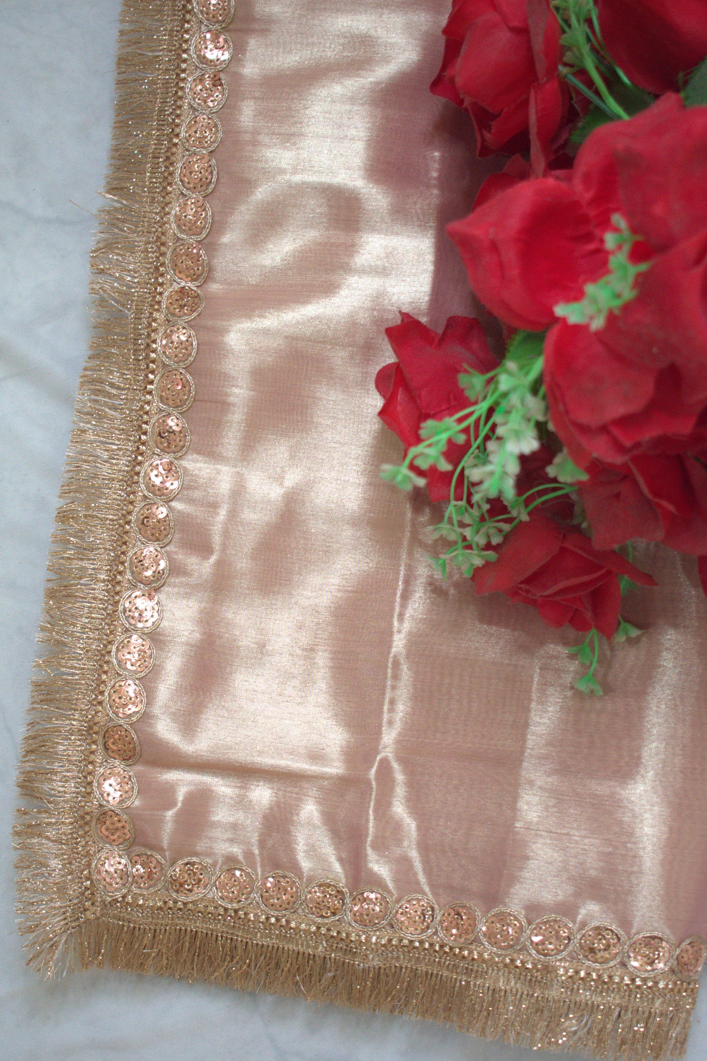 PURE TISSUE ROSE GOLD SAREE WITH ROSE GOLD SEQUIN & FRINGE DETAILING.