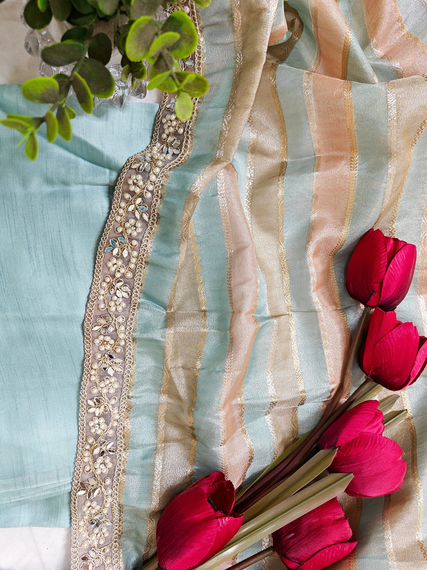 ORGANZA STRIPED SAREE IN SKY-BLUE, PEACH, OLIVE & GOLD WITH EMBELLISHED BORDER.
