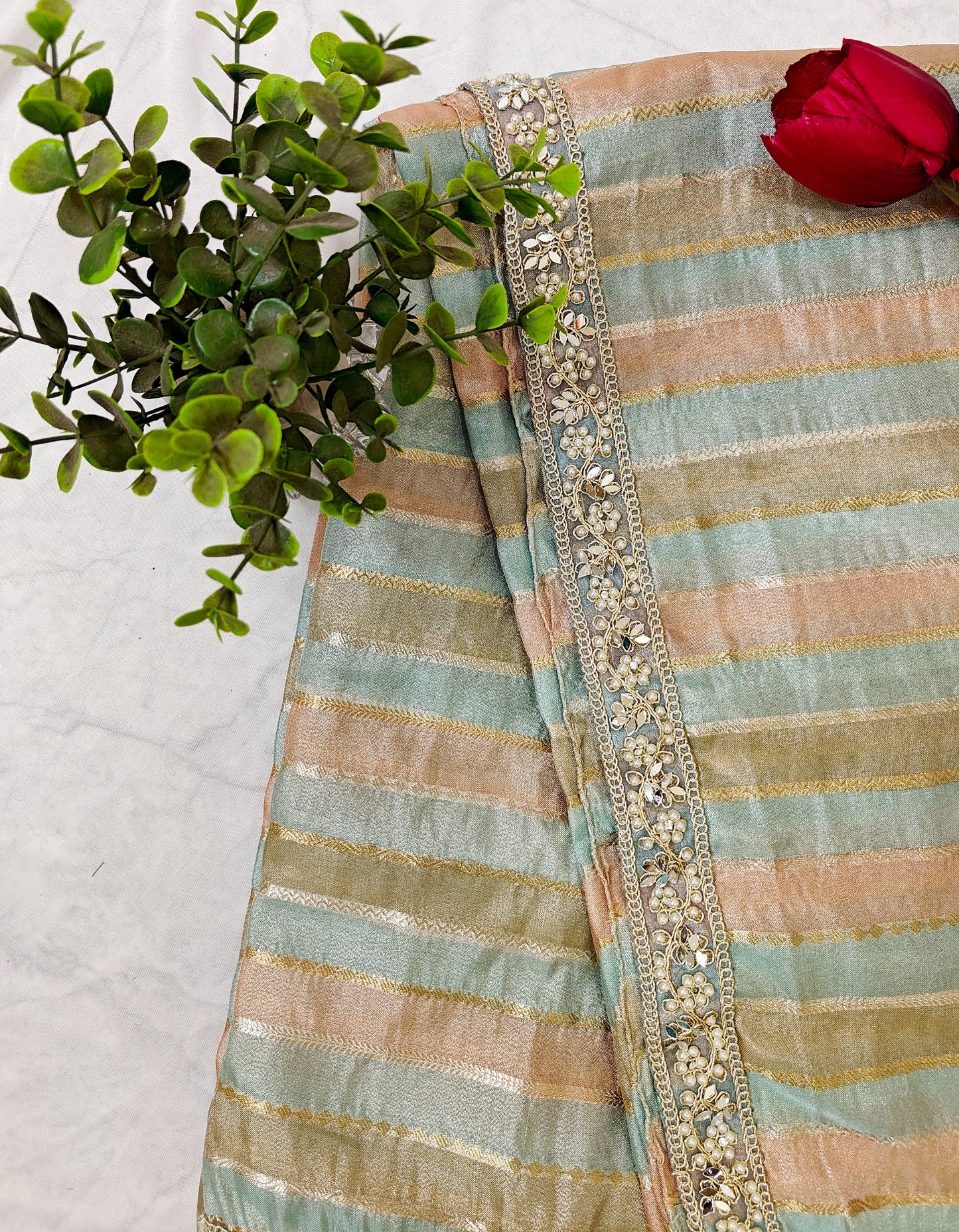 ORGANZA STRIPED SAREE IN SKY-BLUE, PEACH, OLIVE & GOLD WITH EMBELLISHED BORDER.